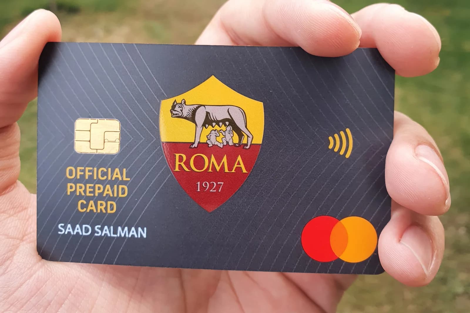 The AS Roma official prepaid Mastercard, showing the club crest, a contactless symbol and the cardholder name